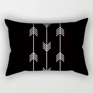 Detailed close-up of a modern rectangular pillowcase with black and white geometric patterns