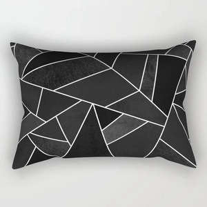 Detail of modern black and white geometric pillow cover with textured marble pattern blocks
