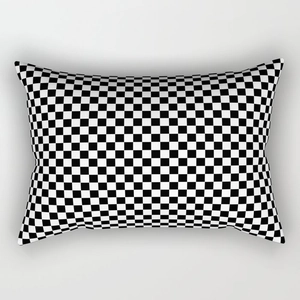 Detail of a minimalist black and white checkerboard lumbar pillow cover fabric texture