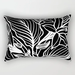 Detail of modern black and white abstract floral pattern on rectangular cushion cover