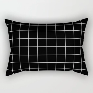 Close-up of black and white geometric grid pattern on a rectangular pillowcase