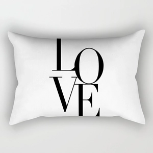 Detail of white rectangular pillowcase with artistic black LOVE typography print
