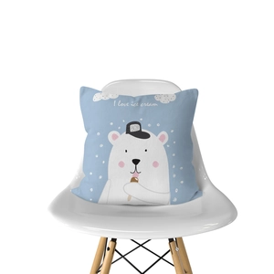Detail of light blue pillowcase with cartoon polar bear eating ice cream on white chair
