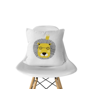 Detail of cartoon lion print cushion cover on white modern Eames style chair