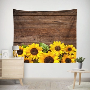 Detail of sunflower tapestry with vintage wood texture hanging on a white bedroom wall