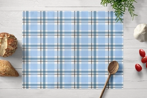 Detail of blue geometric plaid placemat on white wood background with kitchen props