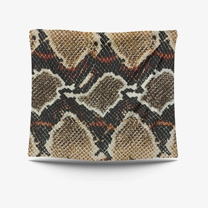 Detailed close-up of a square cushion cover featuring realistic brown snakeskin pattern