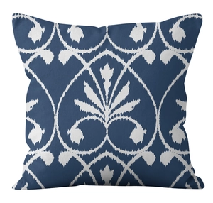 Detailed macro shot of navy blue linen pillow cover with white floral ikat patterns