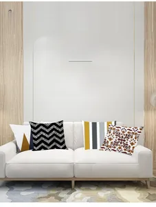 Detail showing various geometric and floral patterns on grey decorative pillow covers