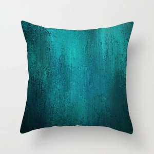 Macro detail of teal geometric throw pillow with artistic frosted texture on canvas