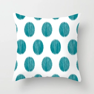 Detailed view of teal geometric circles with artistic line textures on a white cushion cover