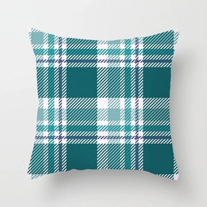 Close-up of geometric teal plaid pillow cover with fine stitching and soft texture