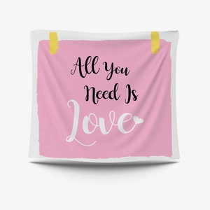 Pink decorative tapestry with All You Need Is Love typography for wall hanging