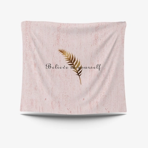 Detail of pink wall tapestry featuring gold feather and Believe in yourself text print