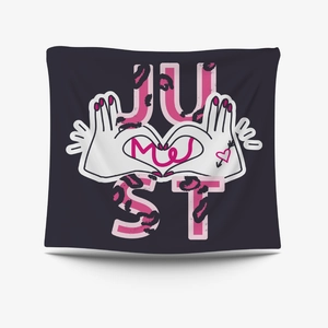 Close-up of heart hand gesture and Just Me artistic lettering on purple wall tapestry