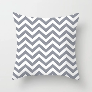 Detailed view of grey and white chevron geometric pattern on peach skin pillowcase