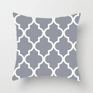 Close-up of gray and white quatrefoil geometric pattern on microfiber cushion cover