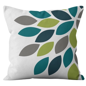 Linen pillow cover featuring modern botanical leaf patterns in teal and olive green