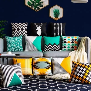 Nordic minimalist geometric and deer silhouette pillow covers set on a modern grey sofa