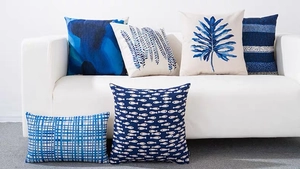 Detailed view of blue geometric and leaf patterns on premium linen throw pillow covers