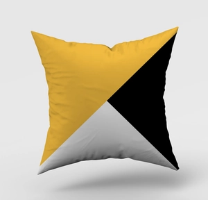 Detail of geometric pillowcase with yellow and black triangles on soft fabric