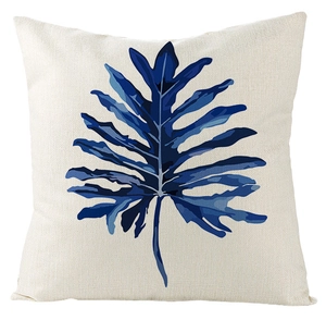 Detail shot of the textured linen pillowcase with modern blue monstera leaf pattern