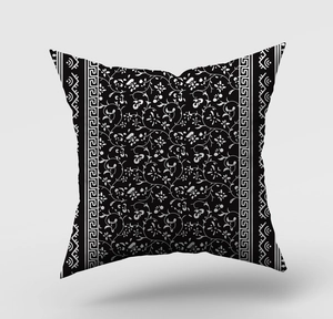 Detail of modern black and white geometric cushion cover with Greek key patterns