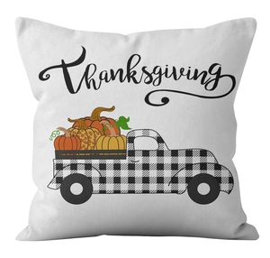 Detailed texture of white Thanksgiving pillow cover with plaid truck and orange pumpkins