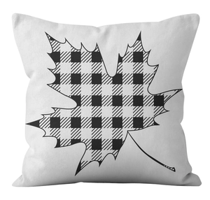 Close-up of buffalo plaid maple leaf print on white textured cushion cover fabric