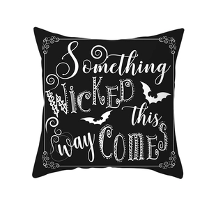 Halloween decorative pillow case with black base and white Something Wicked quote and bats