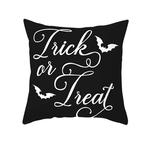 Detail of Halloween pillow case with Trick or Treat text and bat silhouettes decoration