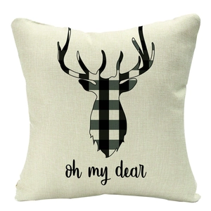 Close-up of linen pillowcase with black buffalo check deer silhouette and Oh my dear text