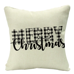 Detailed macro view of linen texture and Merry Christmas lettering on the festive pillow cover