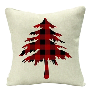 Detailed texture of Christmas pillowcase with red black buffalo plaid tree on linen