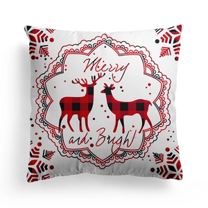 Detail of Christmas pillow cover with reindeer patterns and Merry and Bright text