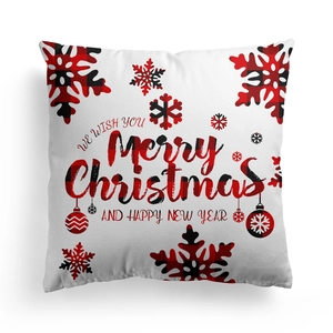 Detail of square Merry Christmas pillowcase featuring red buffalo check snowflake print