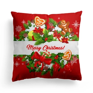 Detailed close-up of a red Christmas pillow cover with festive pine and gingerbread print