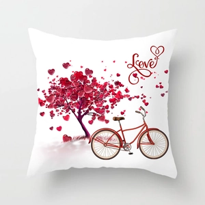 Detail of white square pillowcase with red heart tree and vintage bicycle print