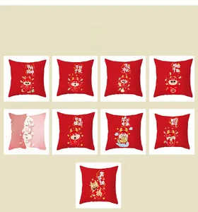 Detail of red plush pillowcases with Chinese New Year cartoon cat and cow motifs