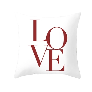 Detailed view of white square pillowcase featuring a bold red LOVE letter print