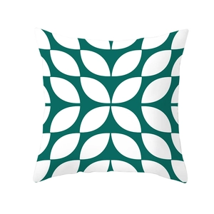 Detailed view of dark green and white geometric leaf pattern on Nordic style cushion cover