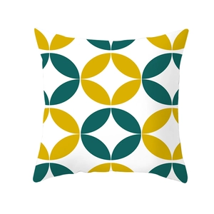 Nordic geometric throw pillow cover with green and yellow petal patterns on white background