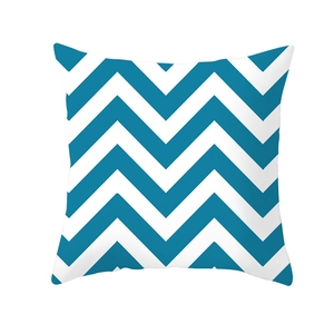 Close-up of blue and white wave pattern fabric on a modern decorative pillowcase