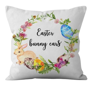Close-up of Easter pillowcase featuring floral rabbit wreath and bunny ears artwork
