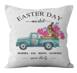 Detail of Easter pillow cover with bunny, vintage truck, and floral watercolor printing