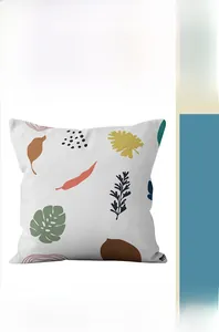 Detail of tropical plant leaf pattern and geometric shapes on Morandi style cushion cover
