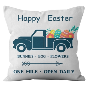 Easter throw pillow cover featuring a blue vintage truck with colorful eggs on white fabric