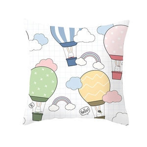Detail of white square pillowcase with grid pattern, hot air balloons and cute rabbits