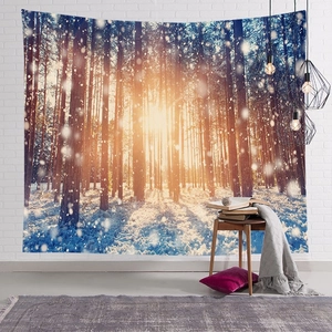 Detailed view of winter forest snow scene tapestry hanging on white brick wall