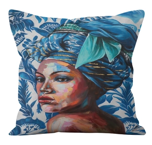 Close-up of African woman portrait print on square pillowcase with blue floral texture